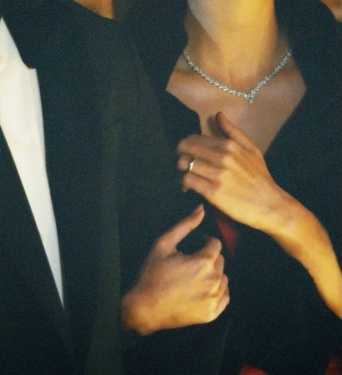 Why do women hold their man's arm?