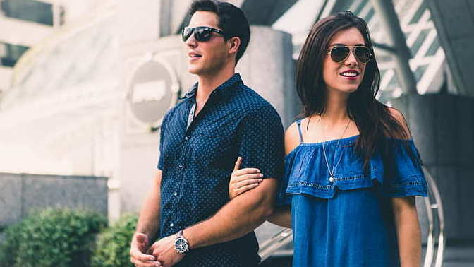 Why do women hold their man's arm?