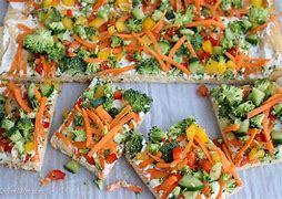 Raw veggie pizza with a ranch sauce and crescent roll crust. My mom made this for me once & I still love it!