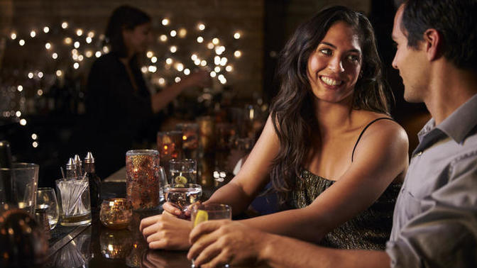 Is buying the woman a drink at the bar, still considered flirting?