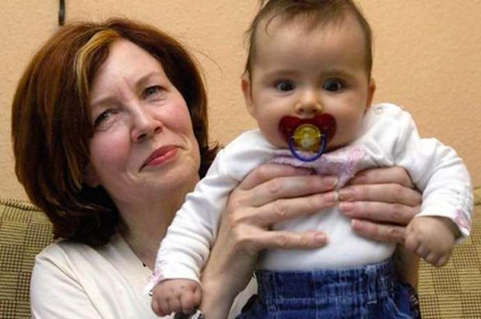 Mature lady with infant