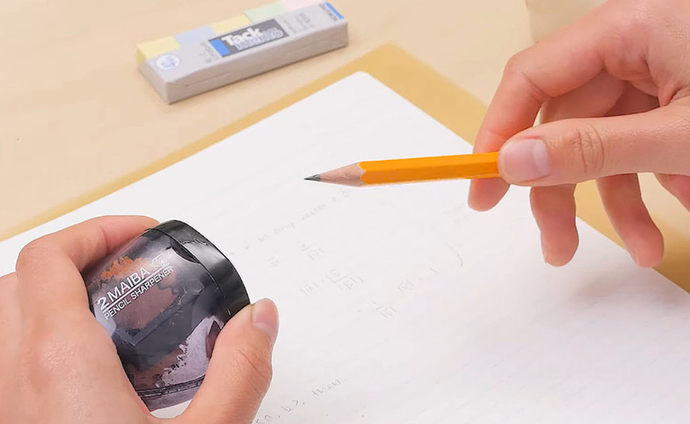 Sharping a pencil.