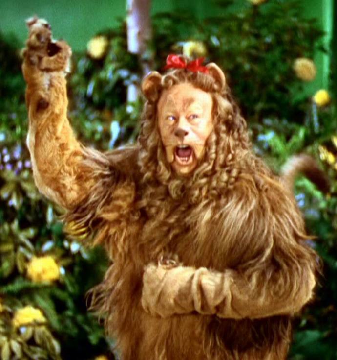 Who played the Cowardly Lion by their performance in their respective movies, Bert Lahr or Ted Ross?