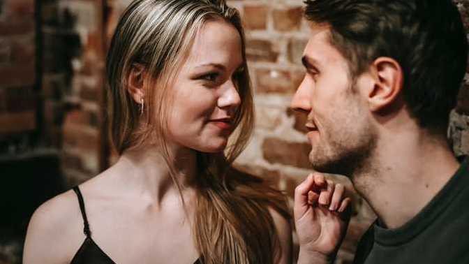How do men act when they have a crush on a woman?