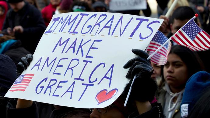 What should Biden do about the immigrants that are here and not approved?