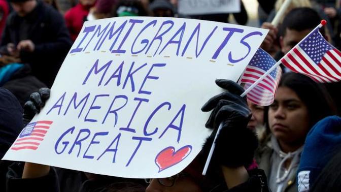 What should Biden do about the immigrants that are here and not approved?