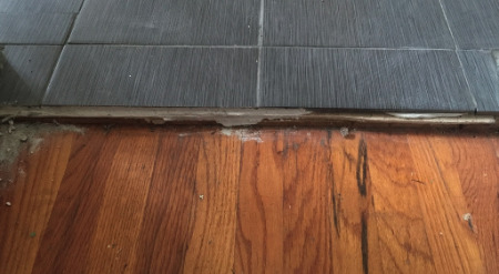 Uneven floor transition leading to another room. 