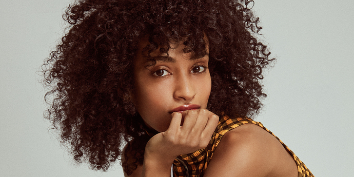 Is it a common perception that curly hair is seen as cute rather than attractive?