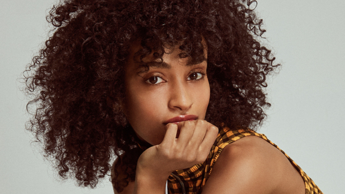 Is it a common perception that curly hair is seen as cute rather than attractive?