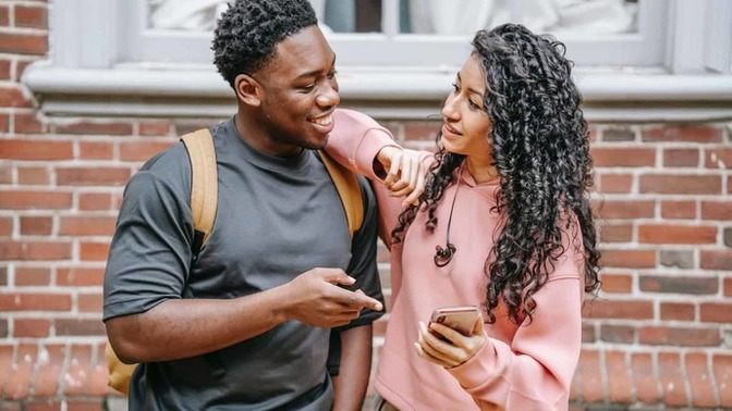 When a guy asks, "Do you still have the same phone number?" what are his intentions with that question?
