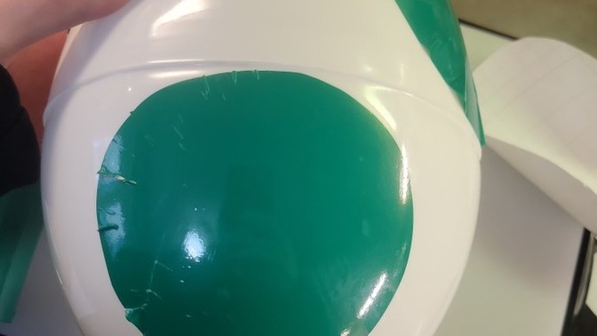 How do I apply a large vinyl round to a large plastic egg, without creases?