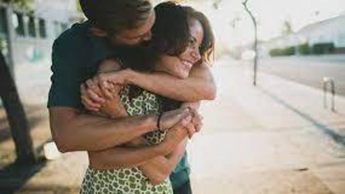 What does it mean if a guy "hugs" you from behind around your neck area (he is taller)?