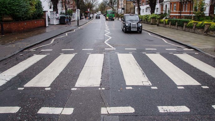 Why are road lines in the UK crooked or zigzagged?