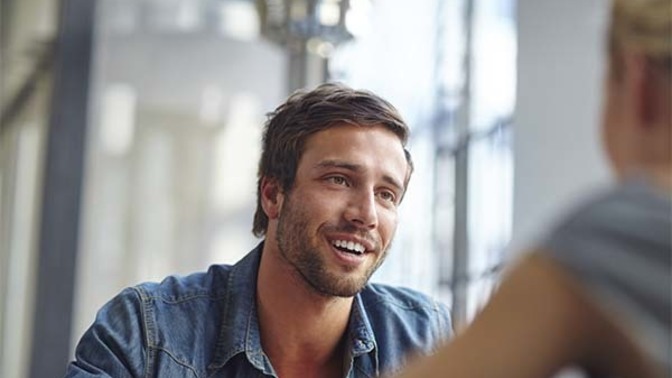 How can I use body language to show interest to a crush?