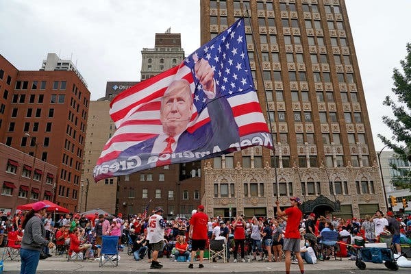 Should immigrants to the US leave their country of origin's flags at the border?