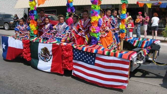 Should immigrants to the US leave their country of origin's flags at the border?