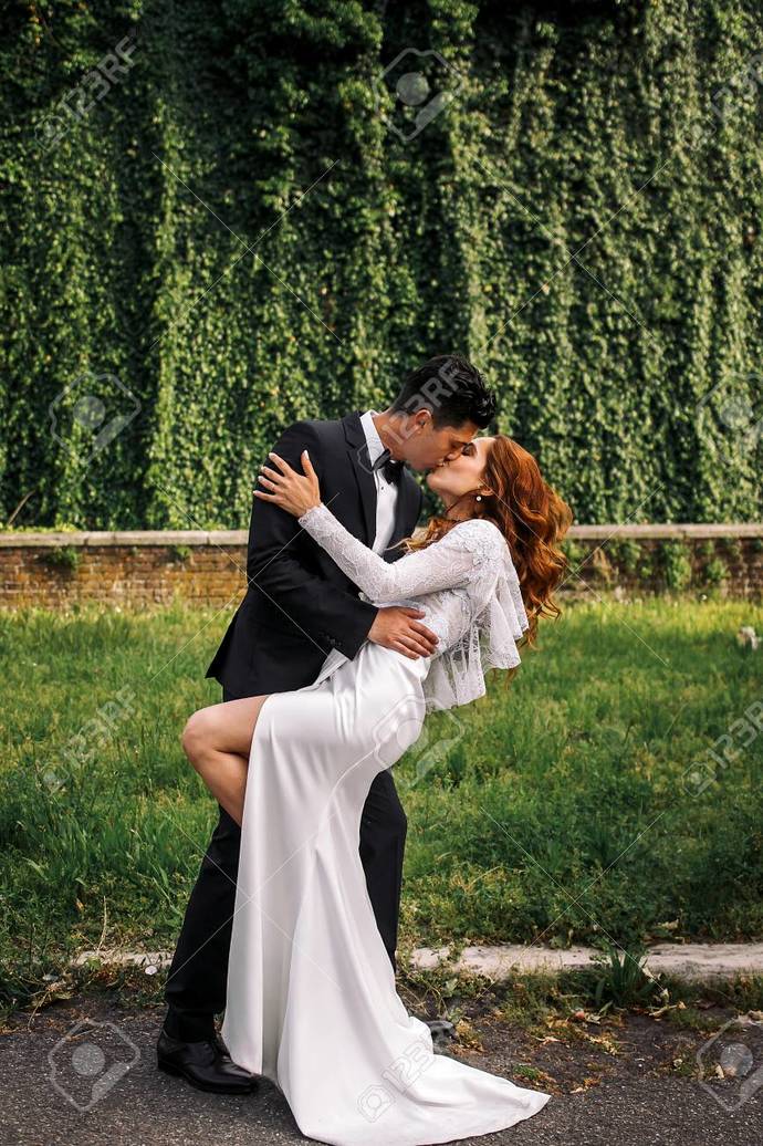 Is it weird for a woman to bend over a guy to kiss him?