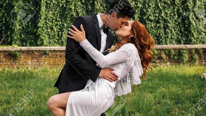 Is it weird for a woman to bend over a guy to kiss him?