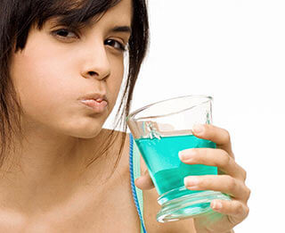 How do you remove FOOD PARTICLES from between your TEETH?