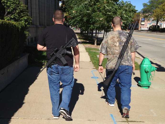 Ammosexual Conservatives walk down a Wisconsin street with their giant guns