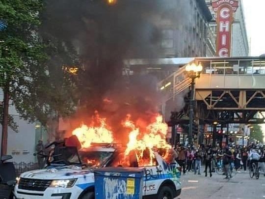 This cop car was set a blaze by black nationalists
