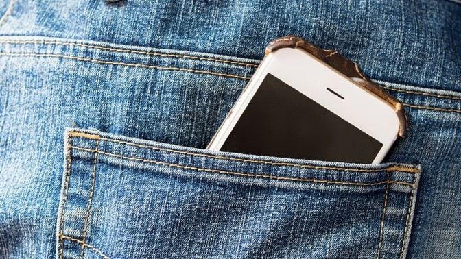 Is it gay for a guy to carry his phone in his back pocket?