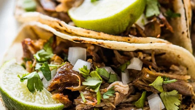 Carnitas tacos or chicken enchiladas?