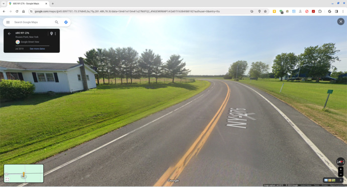 House on left in USA; house on right in Canada.