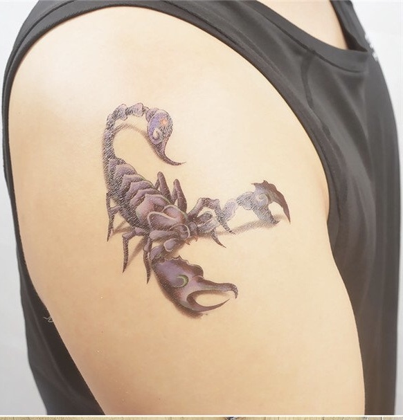Which tattoo on the shoulder looks better by design and placement?