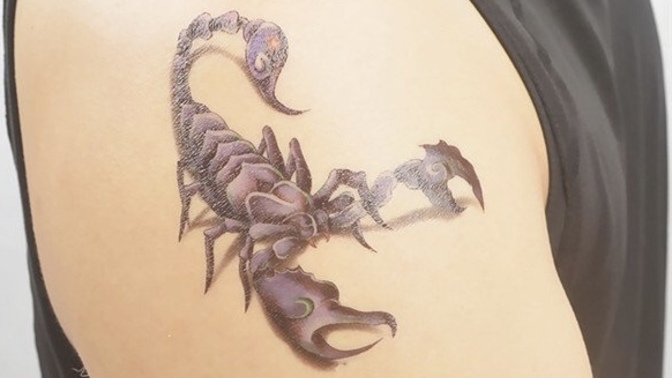 Which tattoo on the shoulder looks better by design and placement?