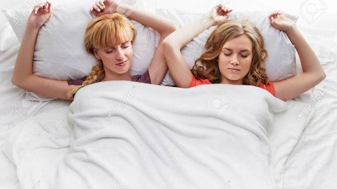 Is it normal for female friends to sleep in the same bed?