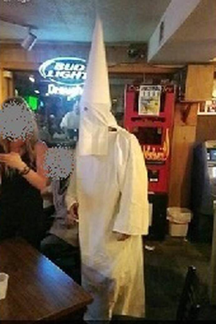 If you saw some guy just casually walking around in a KKK outfit what would you think?