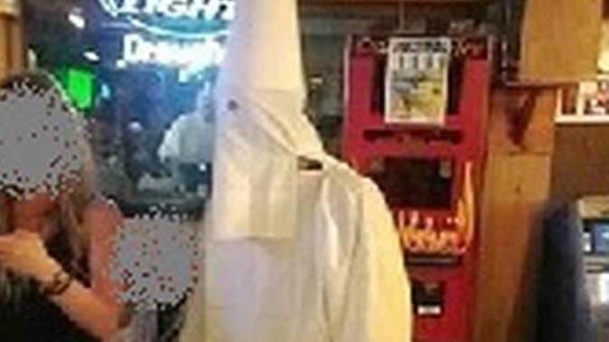If you saw some guy just casually walking around in a KKK outfit what would you think?