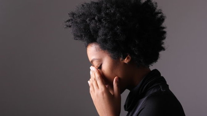 Under most circumstances is the average woman less happy than the average man?