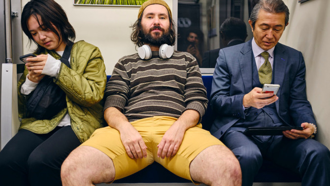Why do men sit with their legs open?