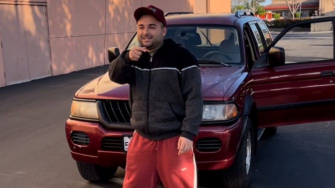 Girls, age 18-26: How do I look in front of this Mitsubishi SUV?