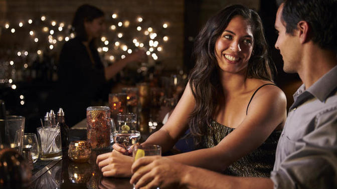 Girl at the bar asked me to buy her a drink. Was she interested or playing games?