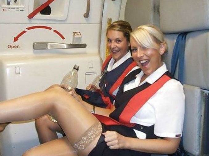 What are these FLIGHT ATTENDANTS doing?