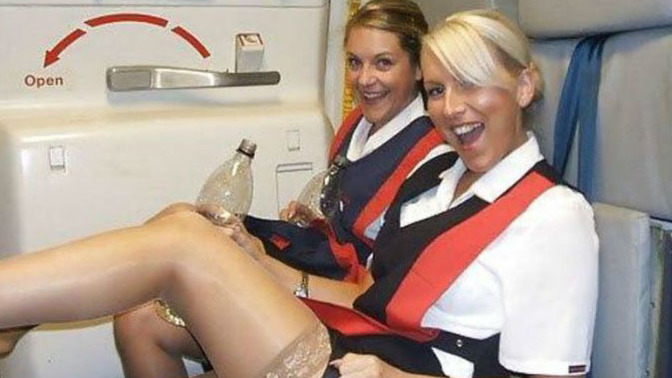What are these FLIGHT ATTENDANTS doing?