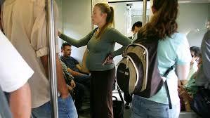 Should a man give up his seat on a bus if a woman is standing?