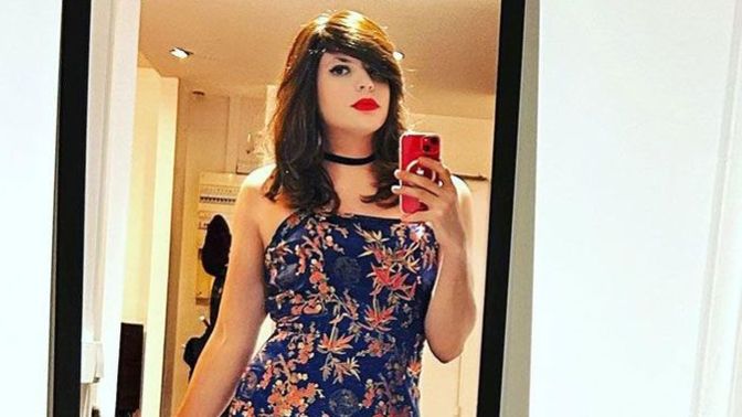 I'm a crossdresser. A man is interested in me. He plays the macho, manly, hyper-hetero guy. So he doesn't assume. What should I do?