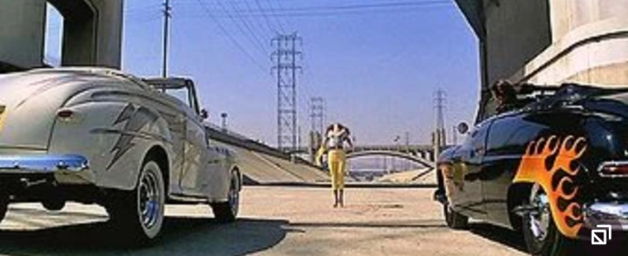 WHO raced what CAR in the movie GREASE?