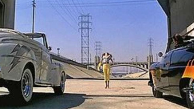WHO raced what CAR in the movie GREASE?