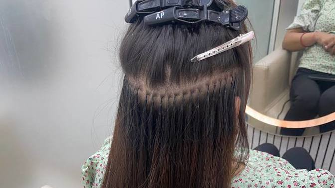 How are hair extensions applied?