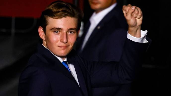 Baron Trump throwing black power sign