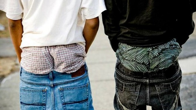 Why girls can show boobskin but guys can't show boxers?