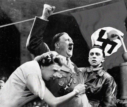 The Hitler photo is real, who is going to say that Trump did not want to recreate this moment for his cult?