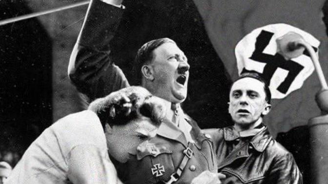 The Hitler photo is real, who is going to say that Trump did not want to recreate this moment for his cult?