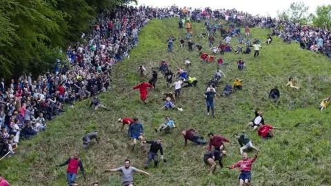 Would you rather try running down a hill as fast as you can after a piece of cheese or try throwing a tree trunk the farthest you possibly can?