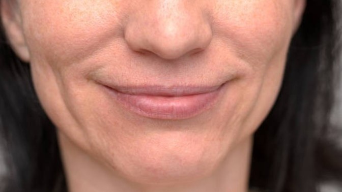 What does it mean when a girl smiles with her mouth or lips closed at you?